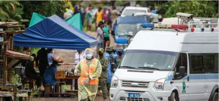  ?? Photo: Leon Lord ?? Residents of Qauia Settelment in Lami gather at the border after a planned protest was foiled by Police on July 7, 2021.