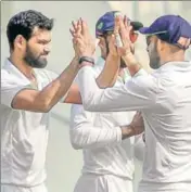  ?? PTI ?? Vidarbha’s Aditya Sarwate (left) dismissed Cheteshwar Pujara twice. He has taken eight wickets so far in the Ranji final.