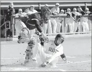  ?? RANDY MOLL SPECIAL TO ENTERPRISE-LEADER ?? William Owens is tagged out as he slides into home plate during play against the Lincoln Wolves at Gravette on April 6.