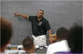  ?? Melissa Phillip / Houston Chronicle ?? J.A. Rob Jr., founder and chief executive officer of the Positive Black Male Associatio­n of Houston, teaches class at Judson Robinson Community Center.