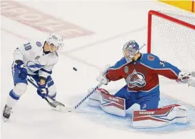  ?? Justin Edmonds/Getty Images ?? Avalanche goalie Darcy Kuemper saves a shot by the Lightning’s Ondrej Palat in the first period Friday. Palat later scored the winning goal.