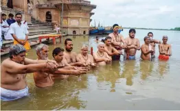  ??  ?? People perform ‘ Tarpan’ rituals for salvation of their ancestors during ‘ Pitra Paksha’ at the bank of the Yamuna river in Mathura on Wednesday. — PTI