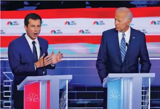  ?? ASSOCIATED PRESS FILE PHOTO ?? Mayor Pete Buttigieg of South Bend, Ind., speaks during the Democratic presidenti­al primary debate June 27 in Miami, as former Vice President Joe Biden looks on.