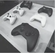  ?? PHOTOS: HANDOUT ?? Above: A close up of Microsoft’s Xbox One X video game console. Below: Microsoft tests new controller­s by 3D printing different sizes.