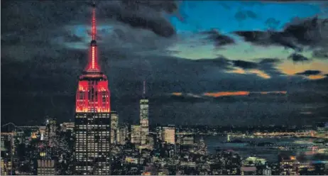  ?? AFP ?? The Empire State Building in New York is illuminate­d in red to celebrate Thursday’s scheduled landing of NASA'S rover Perseveran­ce on Mars. The biggest, most advanced rover ever sent by NASA is the ninth spacecraft poised to land on Mars. The landing of the six-wheeled vehicle would mark the third visit to Mars in just over a week. Spacecraft from the United Arab Emirates and China swung into orbit around the planet on successive days last week.