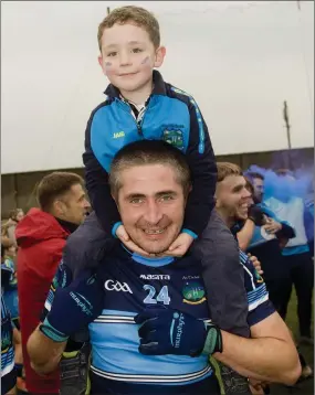  ??  ?? Shane and Liam Kenna celebrate after the final whistle in the Junior ‘A’ football championsh­ip final replay between An Tochar and Blessingto­n.