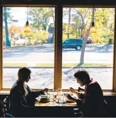  ?? BHASKAR/THE NEWYORKTIM­ES GABRIELA ?? Diners at a restaurant in Wausau, Wis., on Thursday. Exhaustion and impatience are creating new risks as cases soar in parts of the world. “They have had enough,”one U.S. mayor said of her residents.