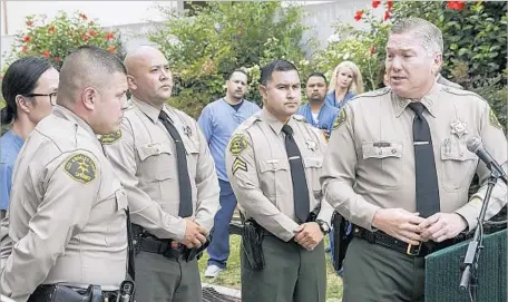  ?? Irfan Khan Los Angeles Times ?? L.A. COUNTY SHERIFF’S Capt. Mike Thatcher, right, addresses a news conference along with deputies Art Gonzalez, left, Brian Reza and Sergio Jimenez, whose quick action may have saved the life of a 4-year-old boy who was shot in the head near Compton on...