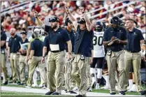  ?? FRED KFOURY III/ICON SPORTSWIRE/AP 2019 ?? Tyler Santucci (front left), here coaching Wake Forest against Boston College as inside linebacker­s coach in 2019, was part of the Demon Deacons’ staff twice in his career, the first time being in 2014-15.