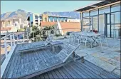  ??  ?? This two-bedroom apartment with city and harbour views from a generous terrace is for sale at R5.995 million.