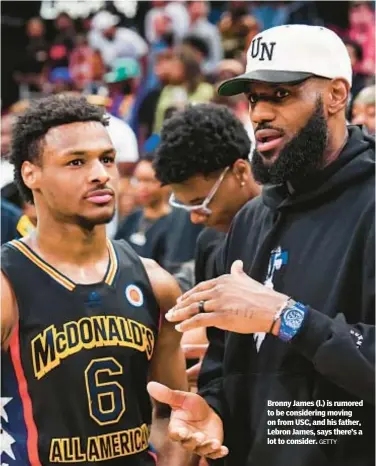  ?? GETTY ?? Bronny James (l.) is rumored to be considerin­g moving on from USC, and his father, Lebron James, says there’s a lot to consider.