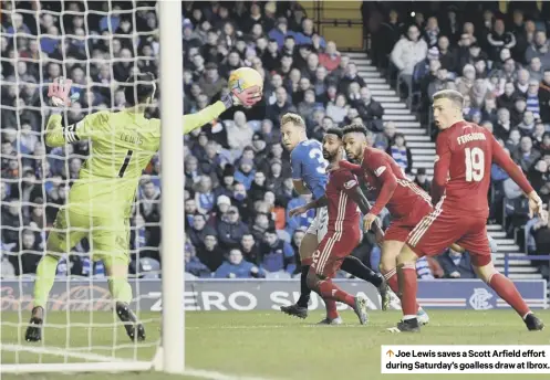  ??  ?? 0 Joe Lewis saves a Scott Arfield effort during Saturday’s goalless draw at Ibrox.