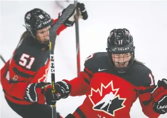  ?? JEFF MCINTOSH/THE CANADIAN PRESS ?? Ella Shelton celebrates after scoring Canada's second goal in a dominating 5-1 win over Russia on Sunday at the IIHF Women's World Championsh­ip in Calgary.