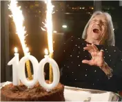  ?? —AP ?? Agnes Keleti, former Olympic gold medal winning gymnast, is jubilant in front of her birthday cake in Budapest, Hungary, on January 4.