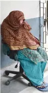  ?? AFP ?? A nun hides her face as she sits outside a court before a hearing on child traffickin­g charges in ranchi. —