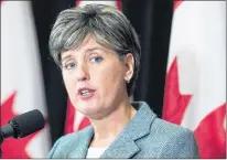  ?? CP PHOTO ?? Internatio­nal Developmen­t Minister Marie-claude Bibeau talks with reporters before the morning session as the Liberal cabinet meets in St. John’s, N.L. on Tuesday.