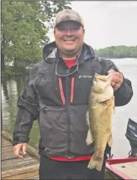  ?? Submitted photo ?? PRIZE FISH: Michael Long, an angler from Hot Springs, holds the first prize fish caught in the 2018 Hot Springs Fishing Challenge. The 4.5-pound largemouth bass is worth $1,000, and was boated on Lake Hamilton near Hill Wheatley Park.