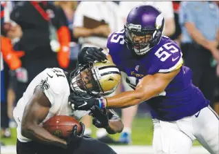  ?? Associated Press photo ?? New Orleans Saints running back Alvin Kamara is tackled by Minnesota Vikings outside linebacker Anthony Barr (55) during the second half of an NFL football game, Monday in Minneapoli­s.