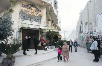  ??  ?? The Walled Off Hotel has a prime view of the Israeli security barrier in the West Bank city of Bethlehem.