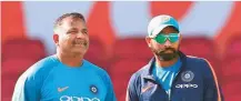  ?? Courtesy: BCCI ?? Indian bowling coach Bharat Arun (left) with Shami.