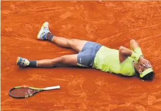  ?? CLIVE MASON/GETTY ?? Rafael Nadal reacts after winning his 12th French Open title last year.