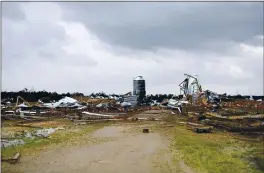  ?? CAM BONELLI — HATTIESBUR­G AMERICAN VIA AP ?? A chicken farm off Strengthfo­rd Cooley Road in Wayne County, Miss., sustained extensive damage on St. Patrick’s Day after a tornado touched down Wednesday. Forecaster­s expected more severe weather with the potential for massive tornadoes, downpours and hail the size of tennis balls.