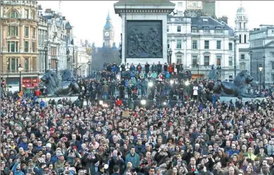  ?? MATT DUNHAM / ASSOCIATED PRESS ?? Crowds gather in London’s Trafalgar Square for a vigil for the victims of Wednesday’s attack, which resulted in the deaths of five people.