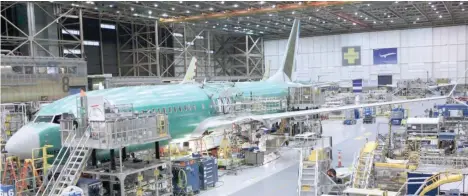  ?? —Reuters ?? A Boeing 737 MAX plane is seen during a media tour of the Boeing 737 MAX at the Boeing plant in Renton, Washington.