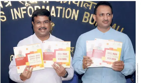  ?? ?? IN JUNE 2018, Skill Developmen­t Minister Dharmendra Pradhan and his junior colleague Anant Kumar Hegde release the Ministry’s report card in New Delhi.