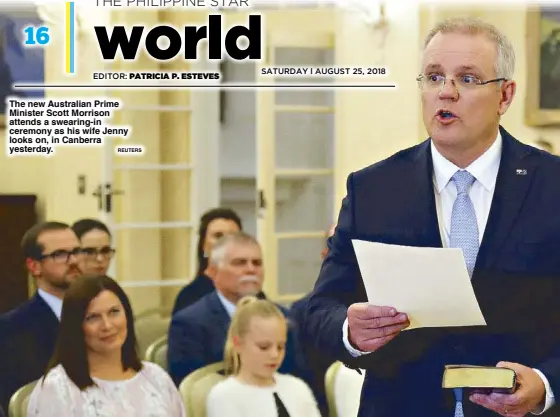  ?? REUTERS ?? The new Australian Prime Minister Scott Morrison attends a swearing-in ceremony as his wife Jenny looks on, in Canberra yesterday.