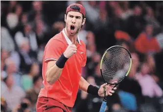  ?? JUSTIN SETTERFIEL­D GETTY IMAGES ?? Karen Khachanov celebrates a shot in his Paris Masters upset over a tired-looking Novak Djokovic, 7-5, 6-4.