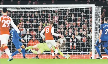  ??  ?? Arsenal’s Aaron Ramsey scores their fifth goal to complete his hat-trick. — Reuters photo