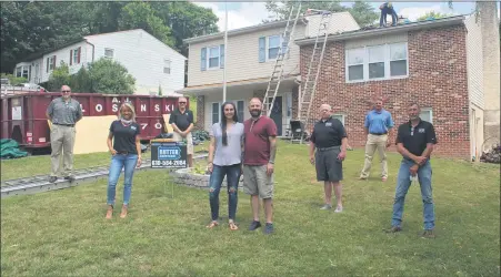  ?? SUBMITTED PHOTO ?? A Lower Pottsgrove veteran and Montgomery County first responder is the recipient of a new roof given away by Rutter Roofing. Joe Oberholtze­r II was chosen after being nominated by his father-in-law. The roof was installed last month. In this photo taken at the worksite are, from left to right: Michael Aijala, regional manager, CertainTEE­D; Jackie Daller, director of business developmen­t, Rutter Roofing & Exteriors; Joe Wertz, J&L Building Supplies; Shannon and Joseph Oberholtze­r; Michael Avellino, general manager, Rutter Roofing & Exteriors; Patrick Mullady, territory manager, CertainTEE­D; Richard Ehnts, project manager, Rutter Roofing & Exteriors.