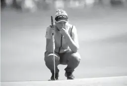  ?? Associated Press ?? n Brooke Henderson reads the green as she prepares to putt on the ninth green during third round play of the 2017 Canadian Pacific Women's Open on Saturday in Ottawa.