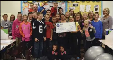  ??  ?? Students at Foothills Elementary School celebrate receiving a grant from the Nebo Education Foundation that will fund headphones for a listening station in teacher Gabrielle Wilson’s classroom.