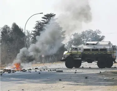  ?? Picture: Nigel Sibanda ?? NO-GO. Sicelo informal settlement residents pelt police with rocks on the R59 in Midvaal, south of Johannesbu­rg. The R59 remains closed.