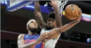  ?? CARLOS OSORIO — THE ASSOCIATED PRESS ?? Detroit Pistons forward Marvin Bagley III (35) attempts a basket as Charlotte Hornets center Nick Richards defends during the first half of Thursday’s game in Detroit.