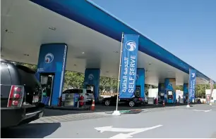  ?? Photo by Ryan Lim ?? The premium and self-service stands at Adnoc stations in Abu Dhabi. —