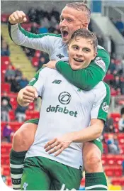  ??  ?? . . . and Leigh Griffiths helps James Forrest celebrate his four goals at Mcdiarmid Park the same day