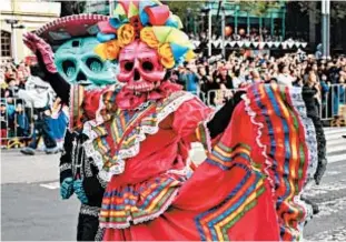  ?? GETTY ?? Mexico City only recently began holding elaborate parades tied to the holiday after a fictional version was depicted in a 2015 James Bond film.