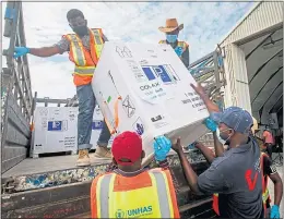  ??  ?? Covid vaccine arrives at the airport in Mogadishu, Somalia