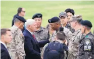  ?? JEE JIN-MAN/ASSOCIATED PRESS ?? Vice President Mike Spence, center, talks with U.S. and South Korean soldiers Monday at Camp Bonifas, near the Demilitari­zed Zone in South Korea. Pence began a 10-day trip through Asia Monday.