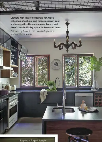  ?? ?? Drawers with lots of containers for Aleit’s collection of antique and modern copper, gold and rose-gold cutlery are a major bonus, and there’s ample display space for treasured items. Cabinets by Galactic Kitchens & Cupboards; tea towel from Mungo
Aleit describes his kitchen as minimalist. The forest feel created by the blue gums outside the window flows over to the interior, giving it a light and fresh feel.