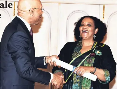  ?? CONTRIBUTE­D PHOTOS ?? Lorna Goodison being invested as poet laureate of Jamaica for 2017-2020 by Governor General Sir Patrick Allen at a ceremony at King’s House on Wednesday.