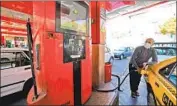  ?? Atta Kenare AFP/Getty Images ?? A MAN pumps gas in Tehran. A cyberattac­k in October disabled pumps at 4,300 gas stations across Iran.