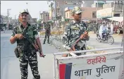  ?? HT PHOTO ?? Security personnel standing guard in Sirsa. Curfew will continue at Bajekan, Nejiakhera and Begu villages located near the dera headquarte­rs.