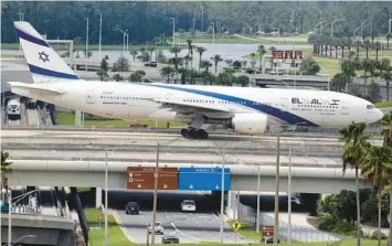  ?? JOE BURBANK/ORLANDO SENTINEL FILE ?? An El Al Israel Airlines Boeing 777 lands at Orlando Internatio­nal Airport in 2019. The Israeli national airline is scheduled to start direct twice-a-week service from Fort Lauderdale-Hollywood Internatio­nal Airport on Monday. It no longer serves Orlando, but continues to operate out of Miami Internatio­nal Airport.