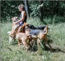  ??  ?? Pomorina and her dogs on a walk outside Moscow.