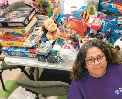  ?? BILL TIERNAN/FREELANCE ?? Most of the donated hygiene products and gifts have already been distribute­d to about 500 area middle school and high school students experienci­ng homelessne­ss. Diana Barrett, founder of Heart of Christmas, poses with the remaining gifts on Thursday in Virginia Beach. Barrett founded Heart of Christmas nine years ago.