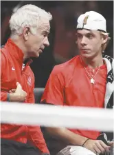  ??  ?? John McEnroe et Denis Shapovalov Associated Press